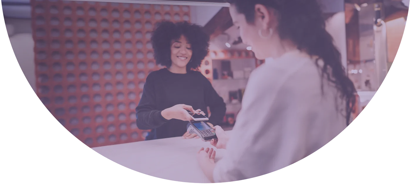 Customer paying by phone at a Durham business