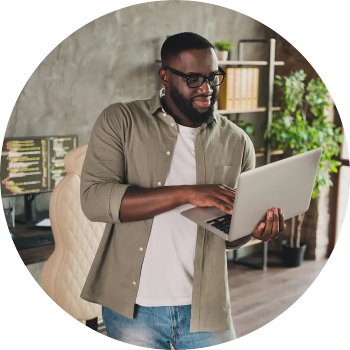 Business owner reviewing payments on a laptop